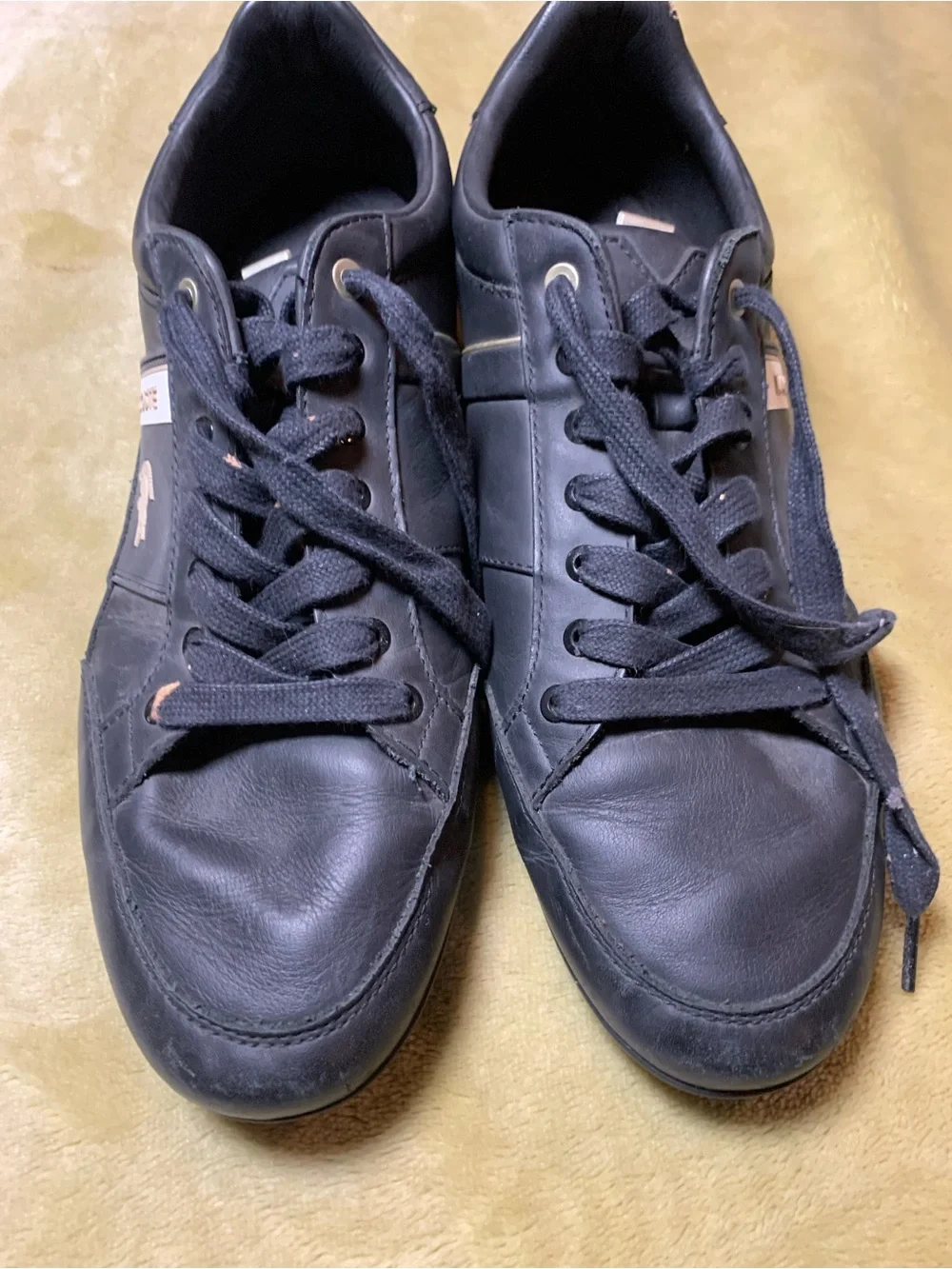 Lacoste Black Leather Low-Top Sneakers with Gold Accents